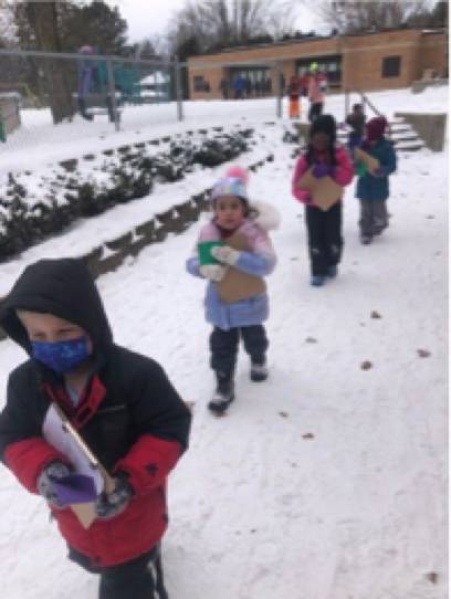 shawmut students walking to outdoor space snow